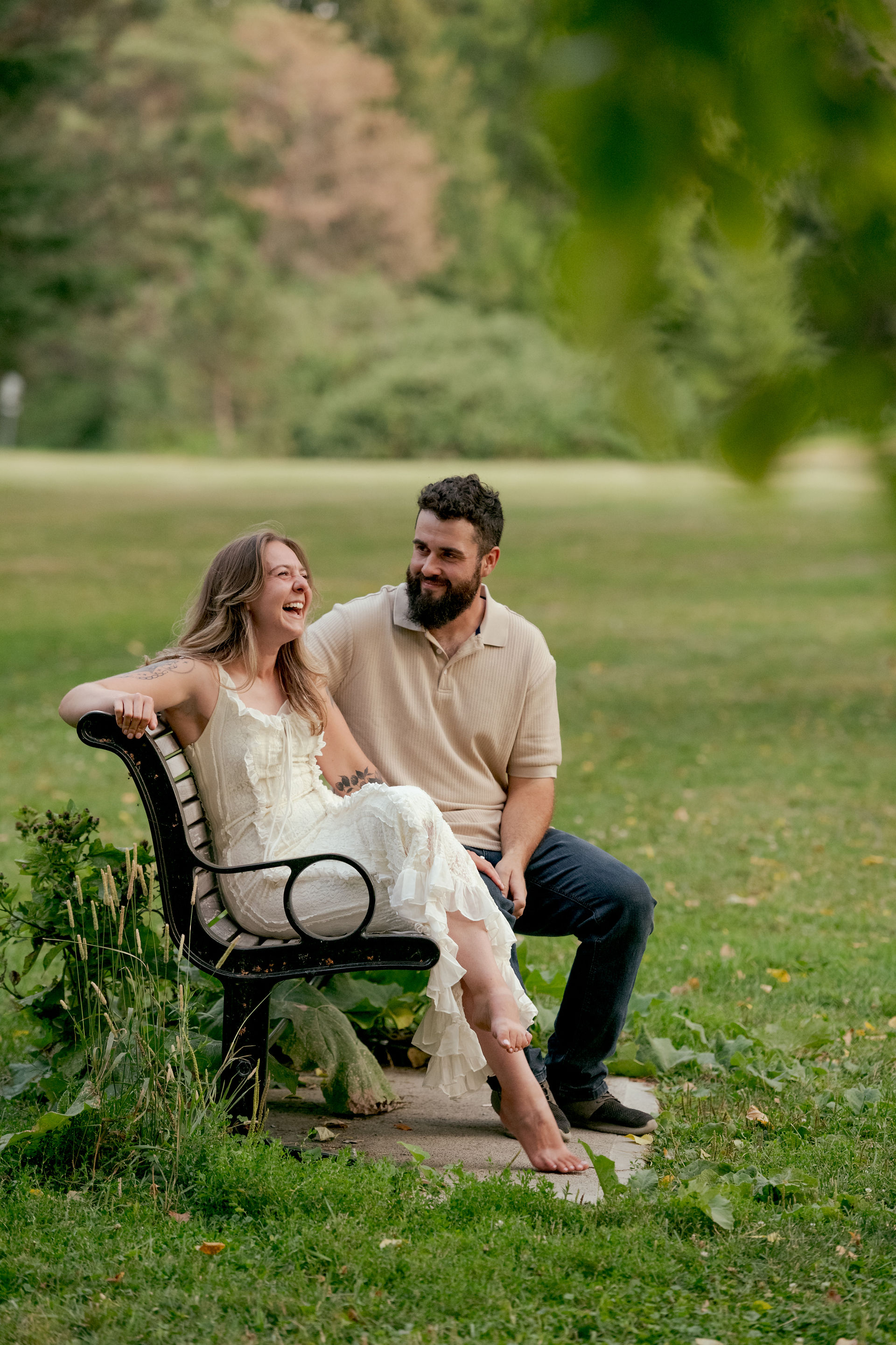 A sunset silloette with purples, blues and the engaged couple's outline among the trees.