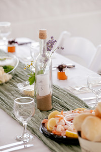 Message in a bottle table settings with a sea-side theme.