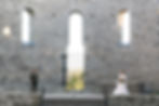 Standing on opposite sides of the landing at the front of the church, the bride and groom share a smile. St. Raphael's Ruins, Glengarry, on.