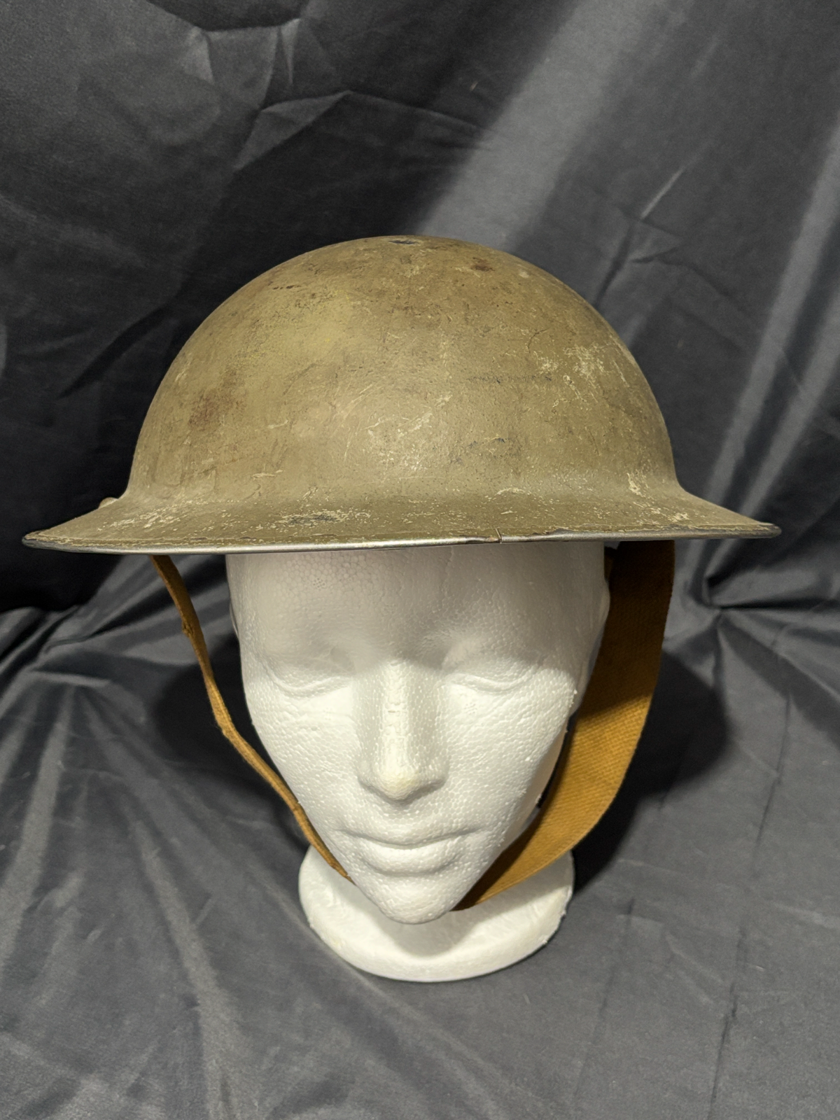 Canadian Army Brodie Helmet with liner and chin strap no other markings visible
