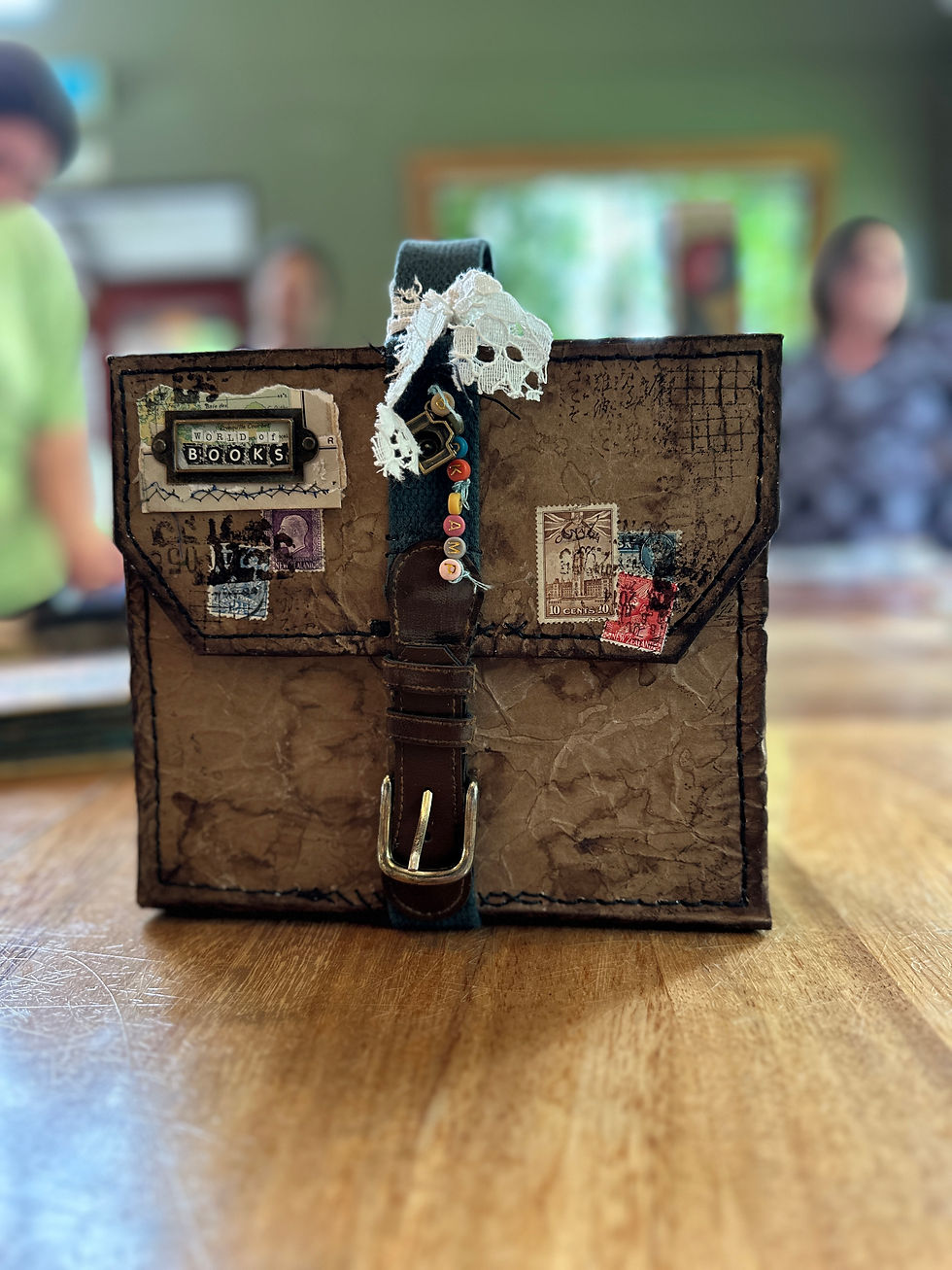 Katy made a suitcase to put her books into.