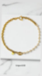 Collier upcyclé Beaumarchais en acier inoxydable réalisé, avec un bouton Haute Couture.