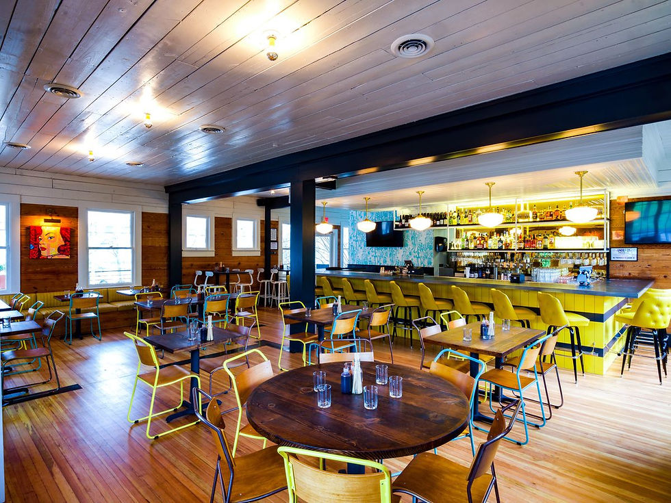 Outdoor patio at Bar Peached with vibrant seating and eclectic decor, ideal for casual office holiday parties in Austin.