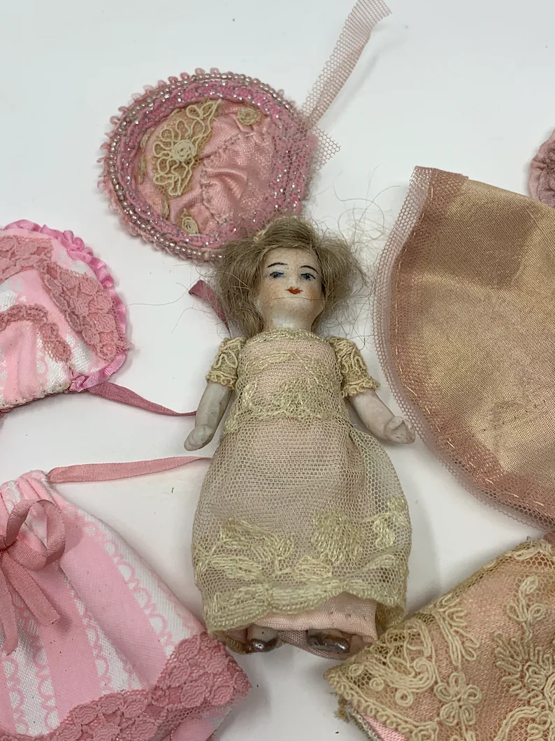 Thumbnail: Antique stunning China doll complete with change of outfits