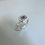 Thumbnail: Handcrafted silver ring with blue sapphire in soft square frame.