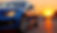 vecteezy_blue-car-parked-during-golden-hour-on-street-with-sunset-and_68851017.jpeg
