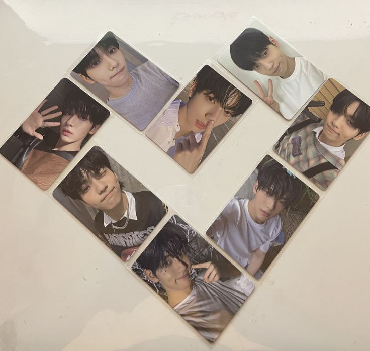 A set of Soobin photocards laid out in the shape of a heart