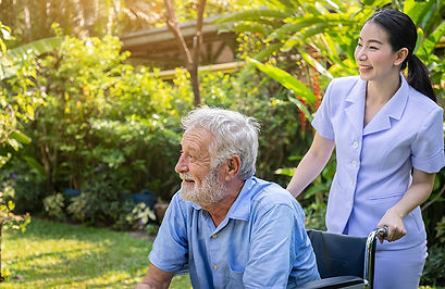happy-nurse-take-care-elderly-man-wheelchair-garden-nursing-home.jpg