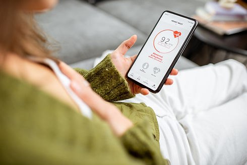 woman-measuring-heart-beat-with-a-smart-phone-LYF3AGB.jpeg