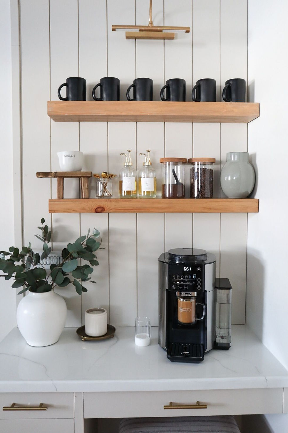 Coffee Bar by Chronicle in the Pines floating wood shelves, quartz counter top, vanity in bedroom