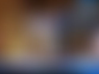 Three men are arm in arm, mid-song, while another man lays facedown on the floor. Written on the wall in marker are the words "I HAVE A BRAIN TUMOR"