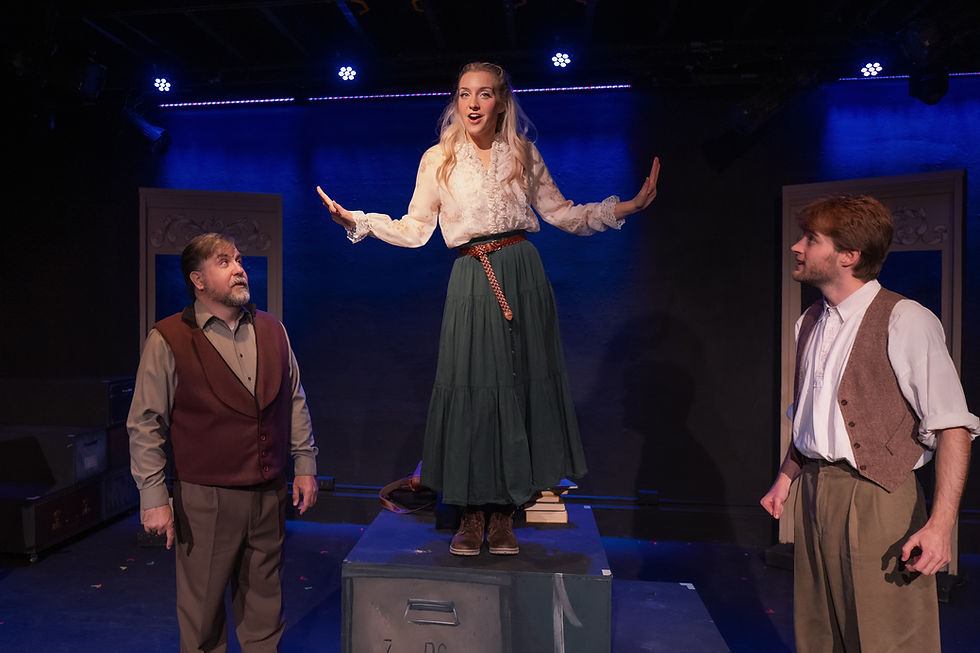 Three actors in early 20th-century Russian costumes sing together on a stage.