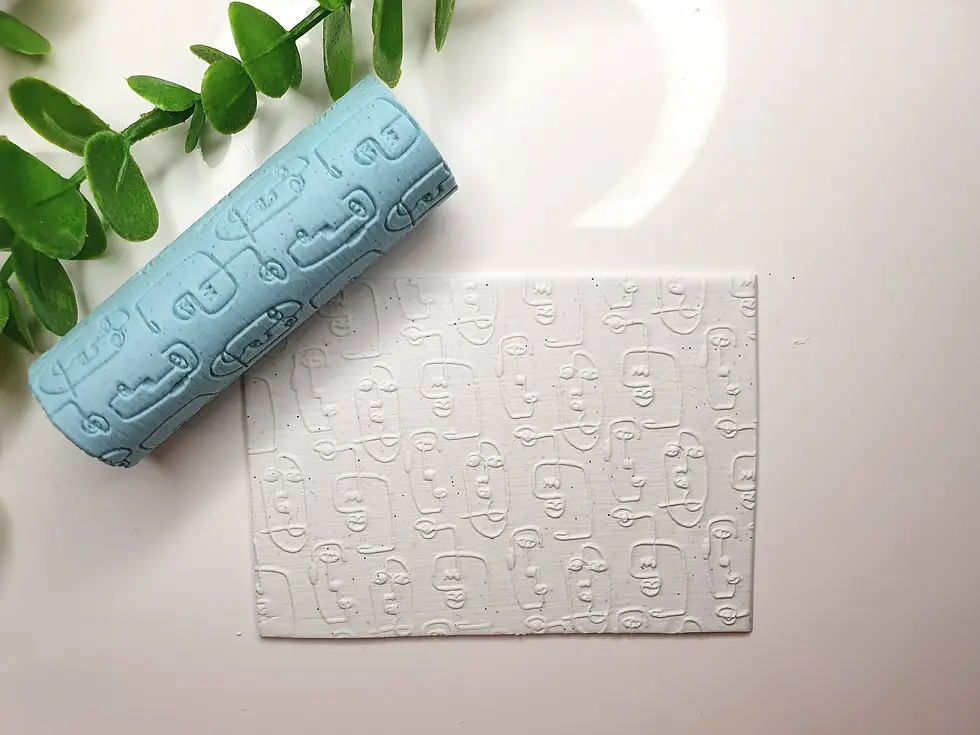 Thumbnail: Textured roller impressing abstract human face pattern into conditioned polymer clay slab