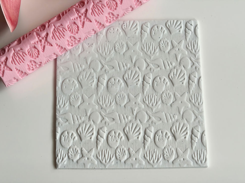 Thumbnail: Textured roller impressing marine life pattern into conditioned polymer clay slab