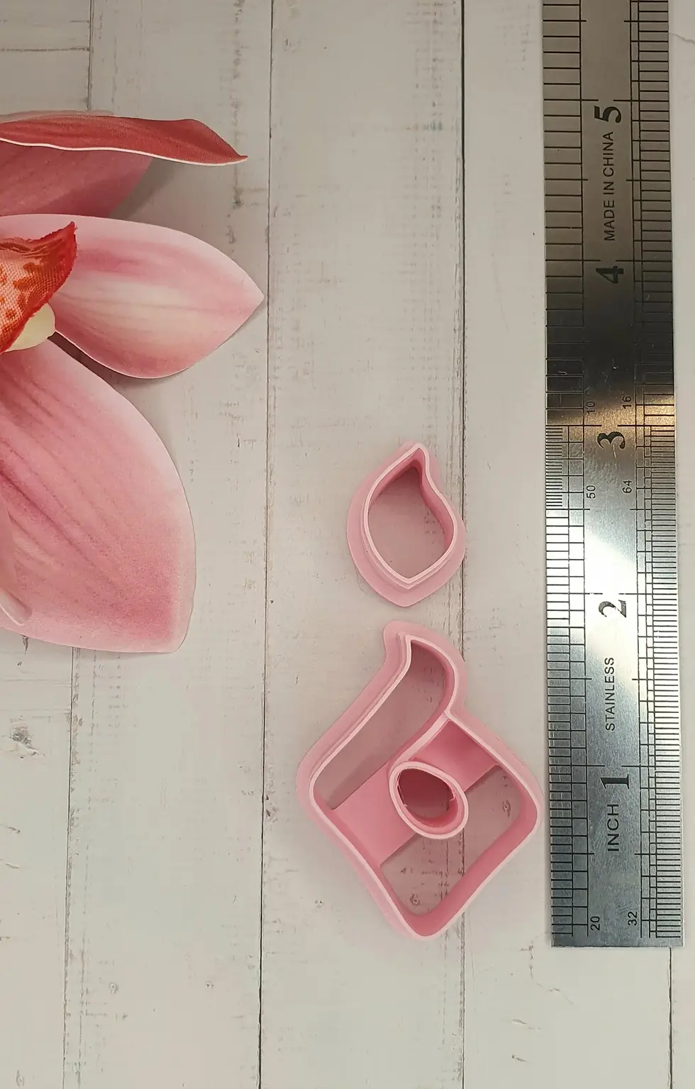 Abstract Fire polymer clay cutters, next to a ruler, 3D printed cutters for clay crafts