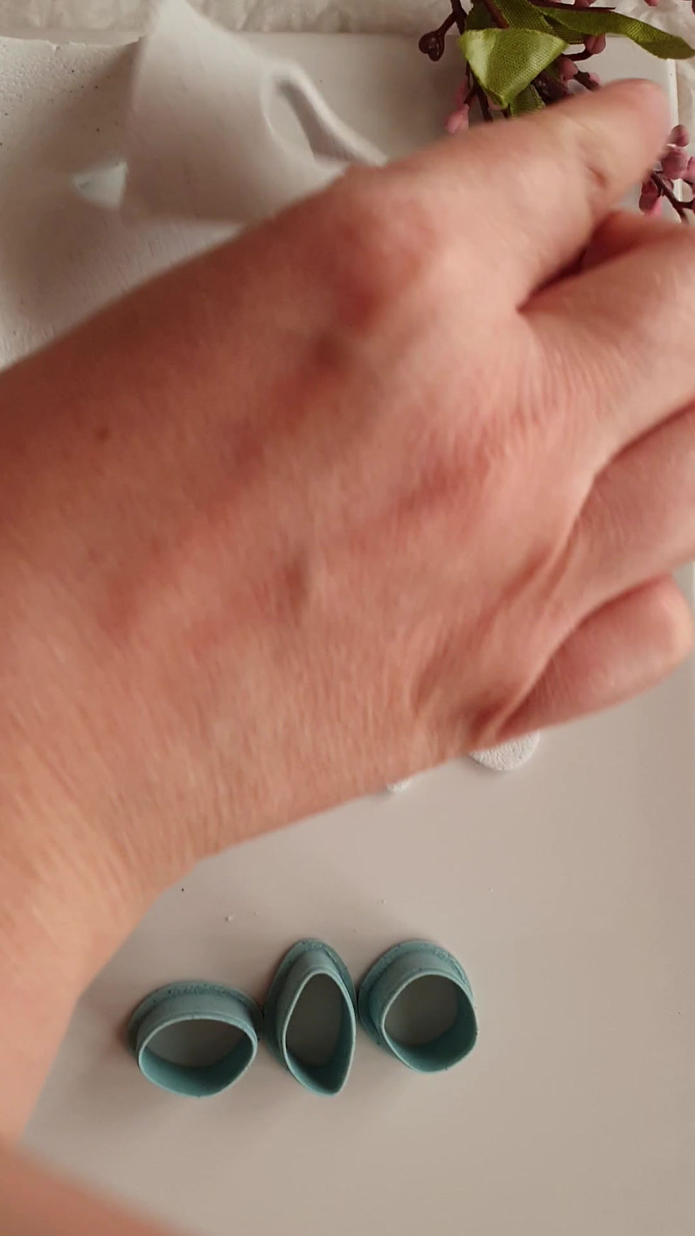 Thumbnail: Video showing a polymer clay cutter cutting clean pabble shapes from polymer clay for jewelry making