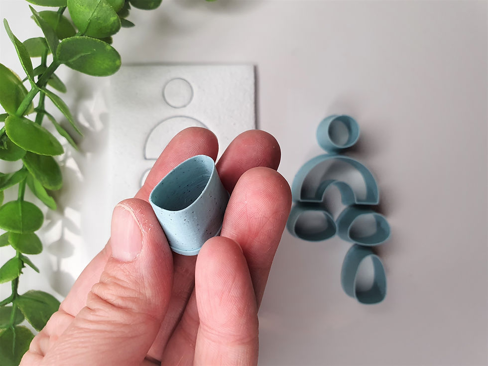 Thumbnail: Pabble polymer clay cutter shown in hand, side view, lightweight 3D printed tool for precise clay cutting