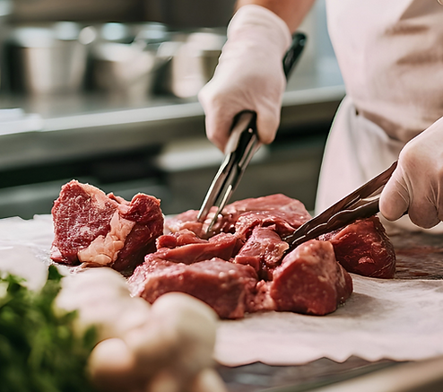 Chef prepping bison meat.png