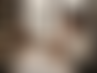 Watchmaker inspecting Cartier Tank in vintage studio