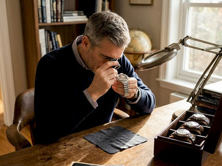 Watch collector authenticating luxury timepiece
