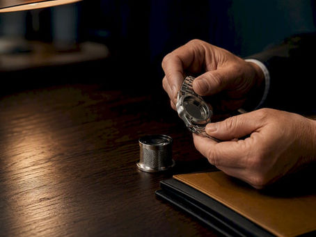 Specialist checking an anonymous luxury watch