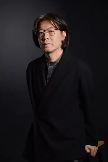 Male executive in black suite on black backdrop at LPS Headshot Studio Bangkok