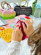 Students learning crochet stitches during a Crochet Workshop at GIGIPAYNE Studio in Bangkok.