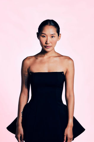 Female model in black dress on pink backdrop for agency test shot at LPS Headshot Studio Bangkok