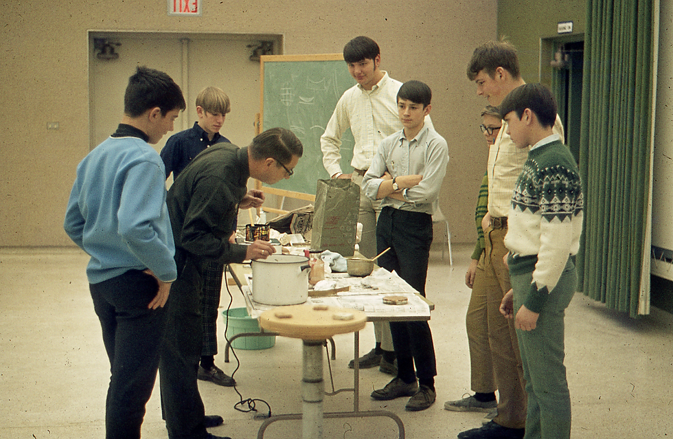 Mark Boyd (fourth from right, arms crossed) at age 15, participates in a GRAAA class about telescope mirror grinding taught by GRAAA leader John Holmquist at the Public Museum in 1970.