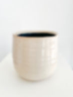 Ivory coloured textured pot