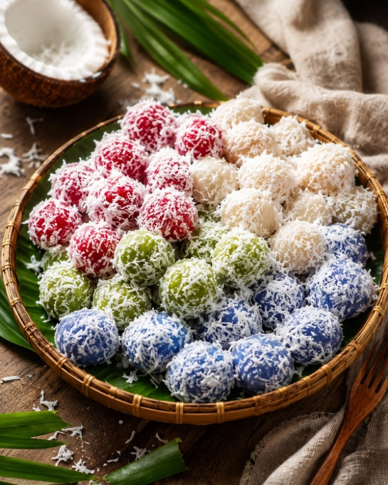 Traditional Thai Khanom Tom dumplings coated in grated coconut