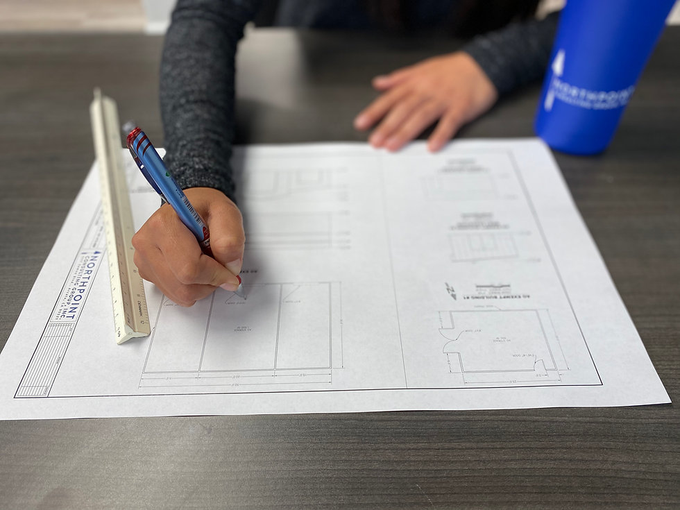 Engineer redlining a building design map