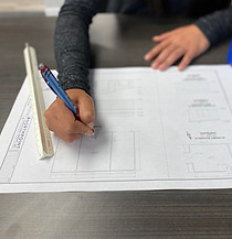 Engineer redlining a building design map