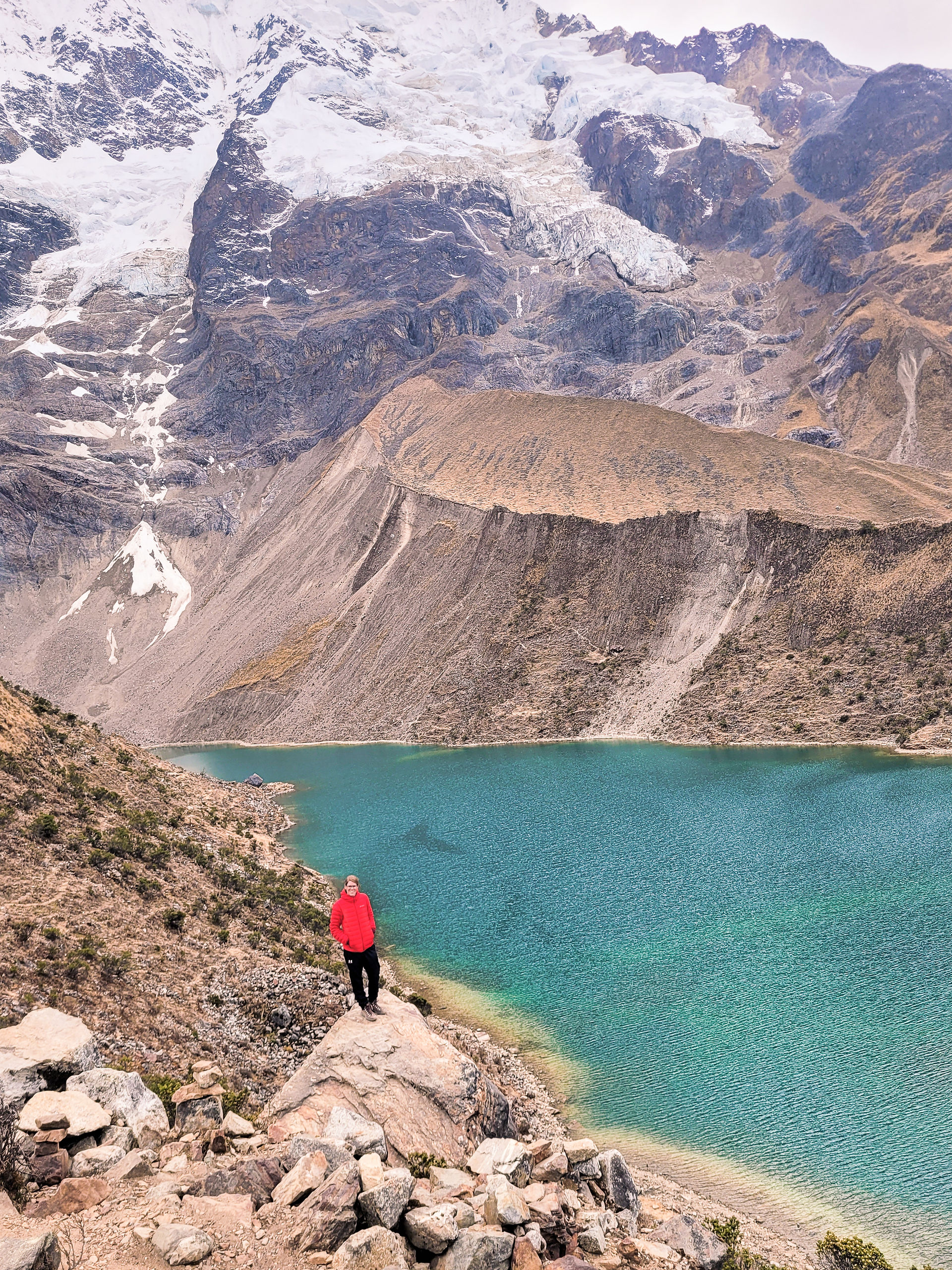 Girl in red standing at viewpoint for Lugana Humantay