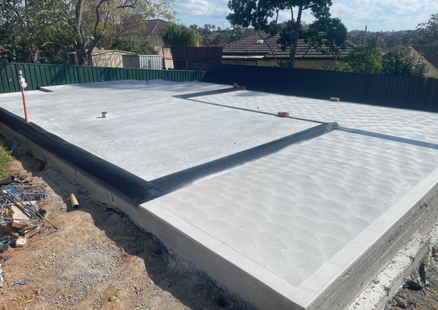 Concrete slab foundation with expansion joints