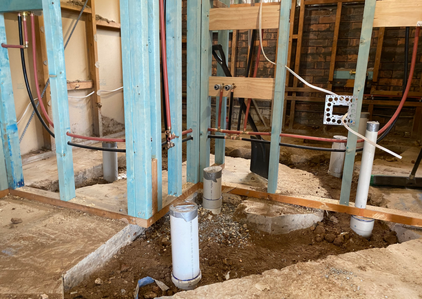 Wood framing and plumbing rough-in during construction