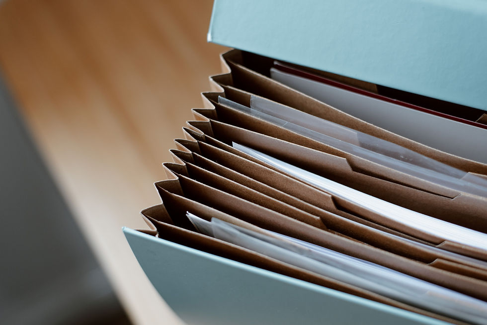 Open folder of business documents kept for record retention
