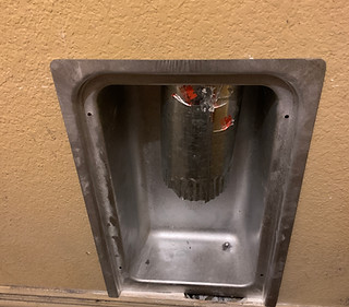 A newly installed dryer vent pan is installed in the wall of a home in Grapevine.