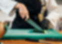 front-view-female-chef-slicing-cucumber.jpg