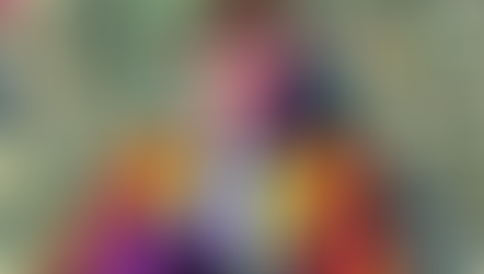 Smiling young man sitting on money