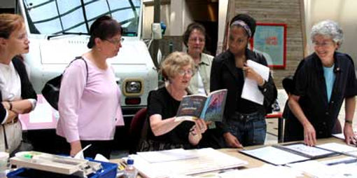 Ann Pope and Lorraine Swerdloff demonstrates calligraphy at National Postal Museum