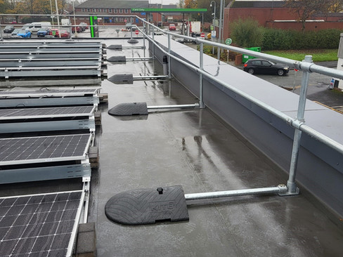 Freestanding roof edge protection system supplied by kite for a leisure centre
