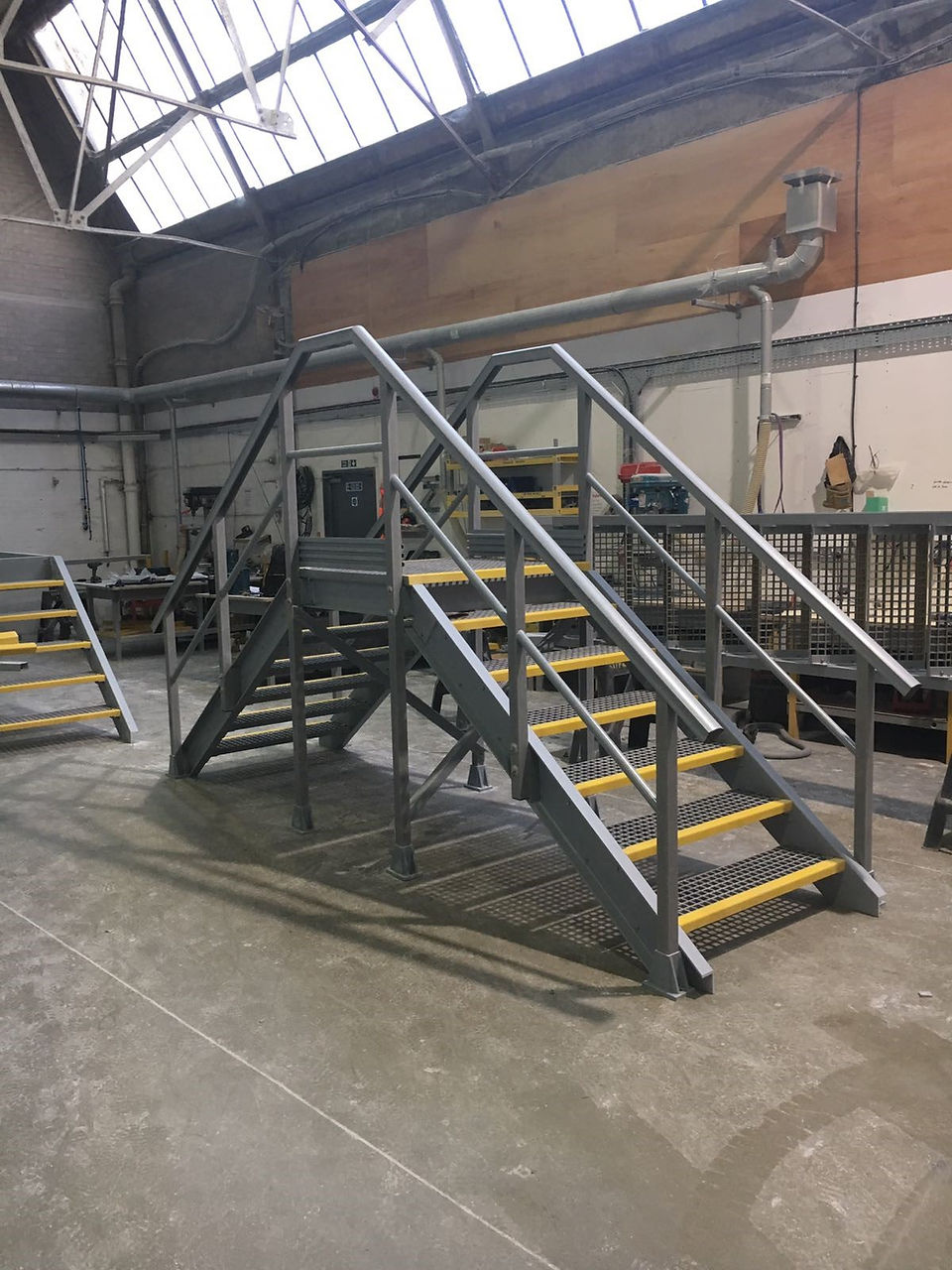 grp step over in grey colour and yellow stair nosing for higher visibility supplied by kite group