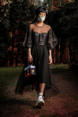asian model with black dress in the woods