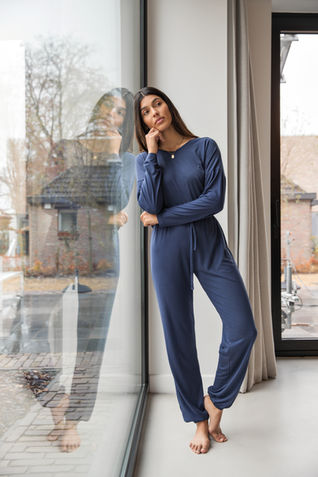 Woman in pyjama posing at home