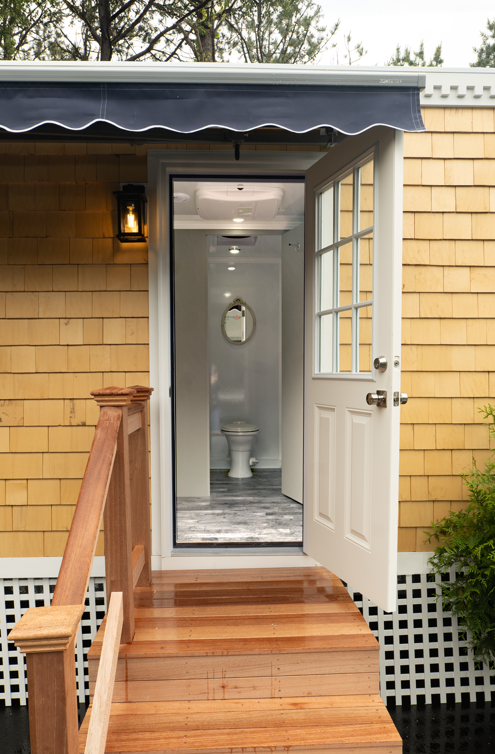 Open door revealing a bathroom interior.