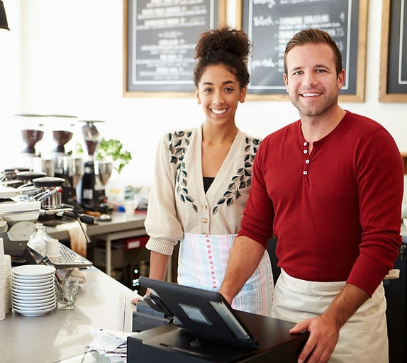 Small business cafe owners working at counter representing retail business clients using tax and accounting services