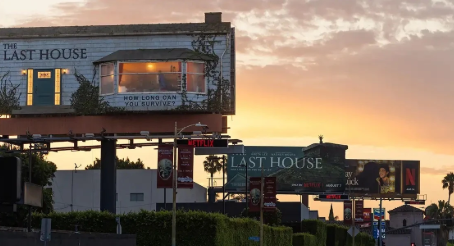 The Last House" billboard at sunset on Sunset Boulevard, built to look like a small weathered house with a lit window, alongside "How long can you survive?" tagline and additional Netflix billboards.