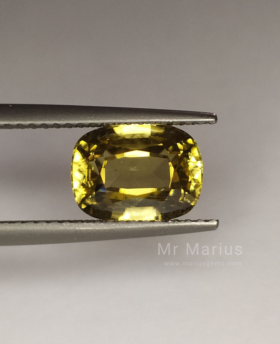 Thumbnail: Brownish yellow, a golden coloured zircon. cushion cut. Front view.