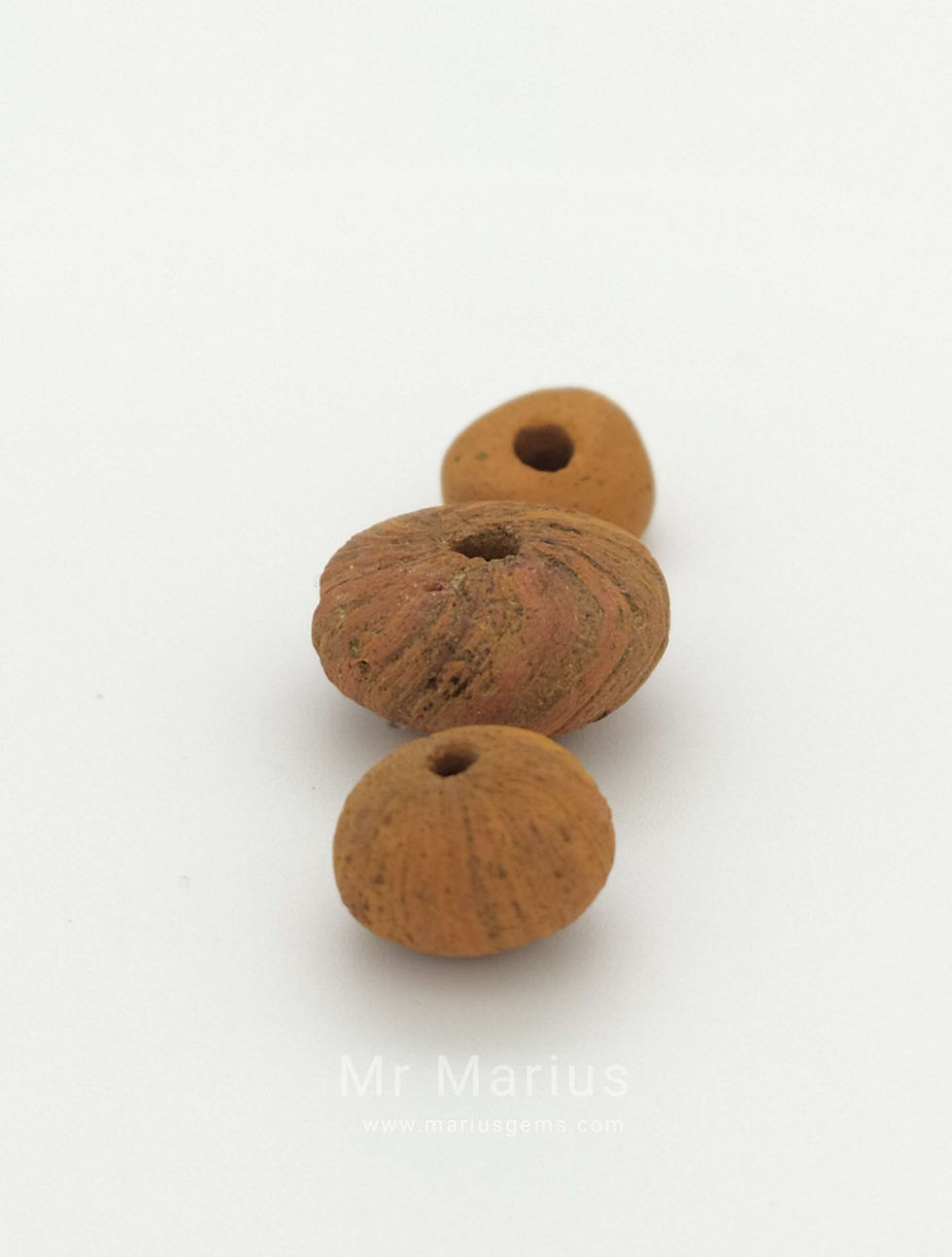 Thumbnail: Makkura ceramic beads. 3 pices, round. marks like a whirvelvind on two of them.